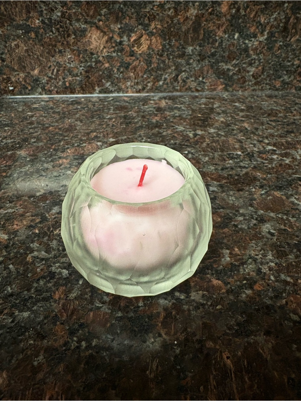 Handmade upcycled candle rose scented wax poured into a small thrifted jar
